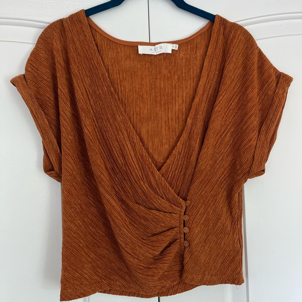 Orange wrap-style top with button detail size Medium